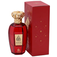 Red perfume bottle with gold cap and Nisrine branding next to a matching red box on a white background.
